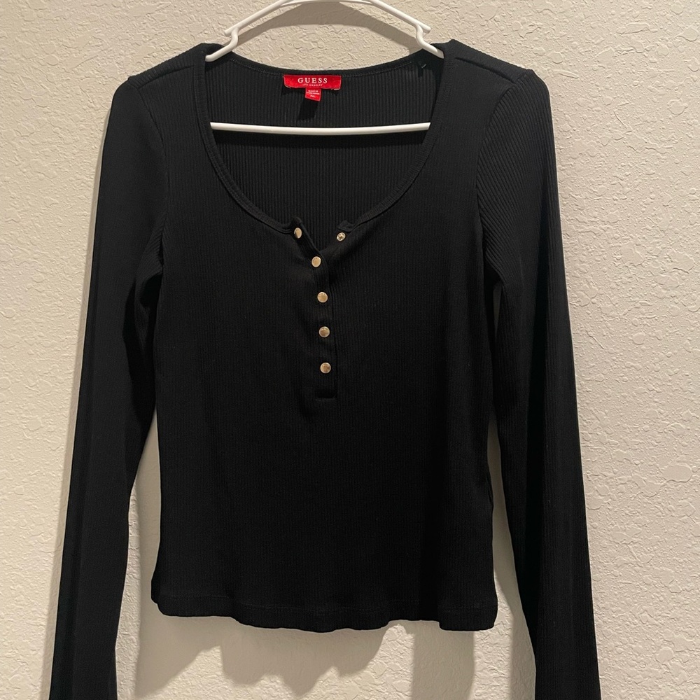 Long sleep black Guess top. Super cute and stretches.